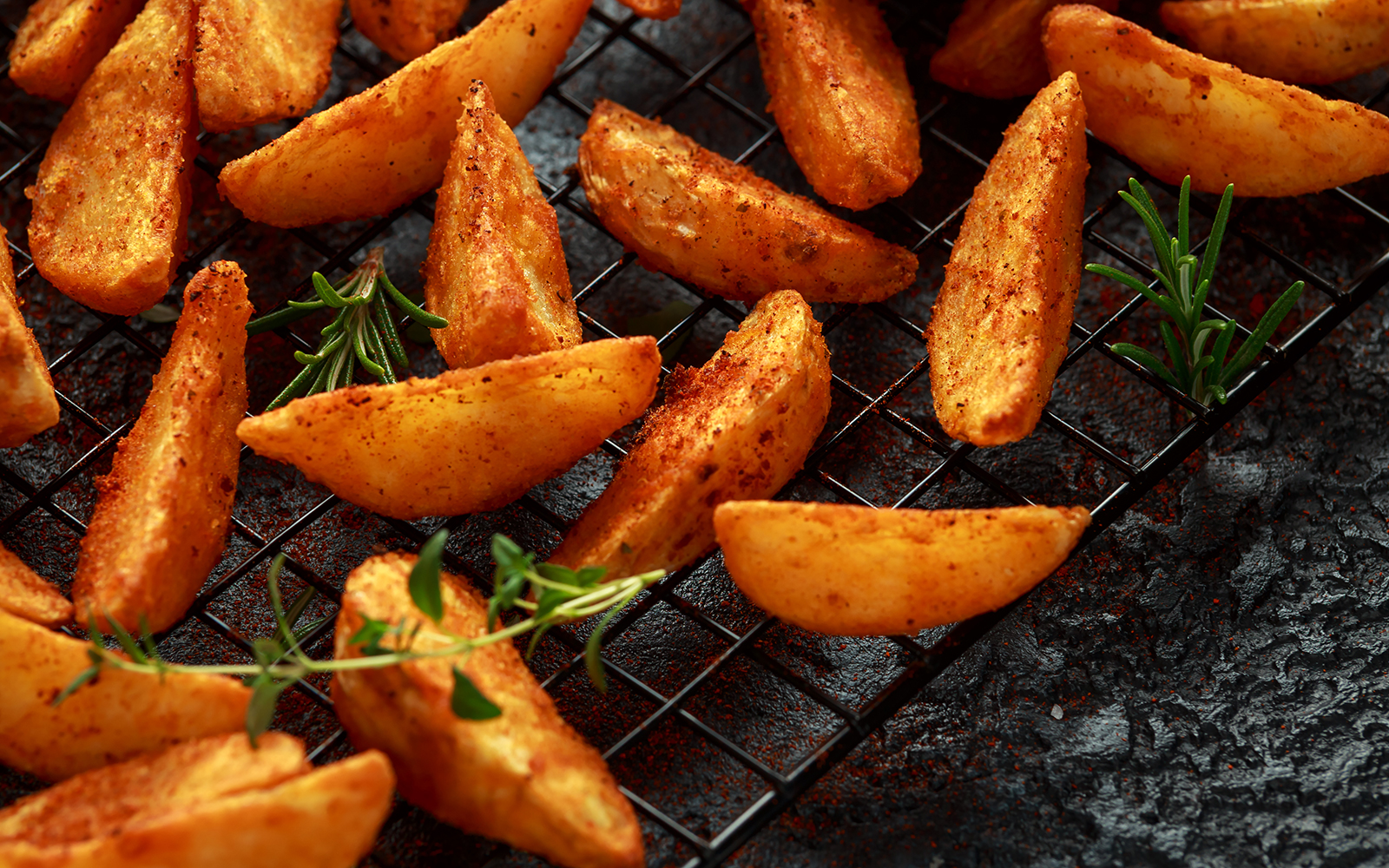 Paprika potato wedges fries chips, with ketchup and thyme